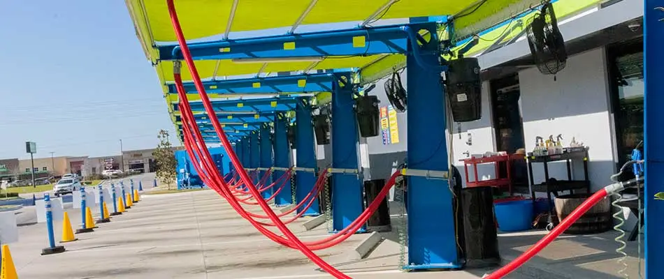 A line of newly constructed car wash vacuums.
